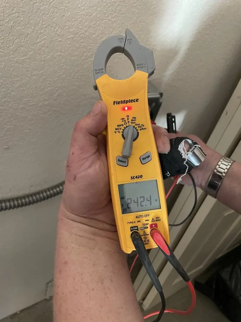 Voltage testing with clamp meter during Recessed Lighting Installation in Val Verde Park